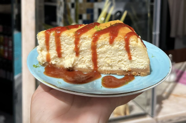 A slice of caramel cheesecake on a pastel plate